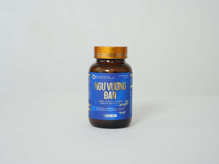 Smiling female veterinary nutritionist holding copper supplement bottle and lab notebook, standing beside shelf of pet supplement bottles